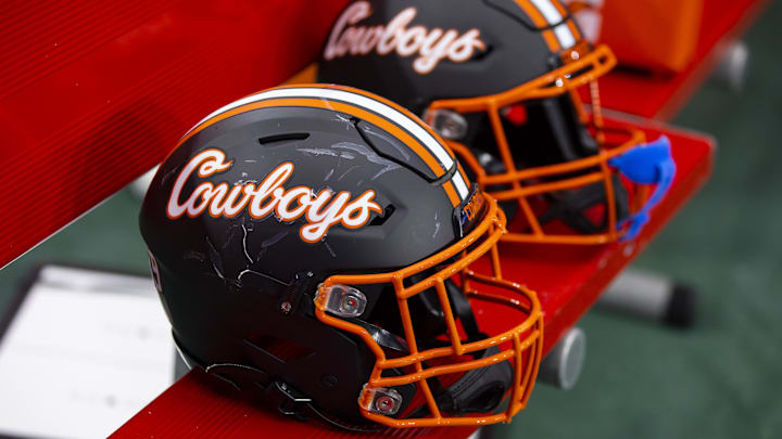 Jan 1, 2022; Glendale, Arizona, USA; Detailed view of an Oklahoma State Cowboys helmet during the 2022 Fiesta Bowl at State Farm Stadium. Mandatory Credit: Mark J. Rebilas-Imagn Images