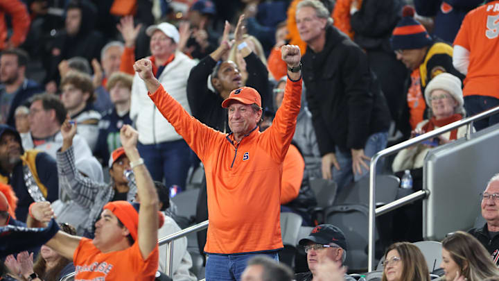 Dec 27, 2024; San Diego, CA, USA; Syracuse Orange fans celebrate a touchdown against the Washington State Cougars during the second half at Snapdragon Stadium. Mandatory Credit: Abe Arredondo-Imagn Images Dec 27, 2024; San Diego, CA, USA; Syracuse Orange fans celebrate a touchdown against the Washington State Cougars during the second half at Snapdragon Stadium. Mandatory Credit: Abe Arredondo-Imagn Images