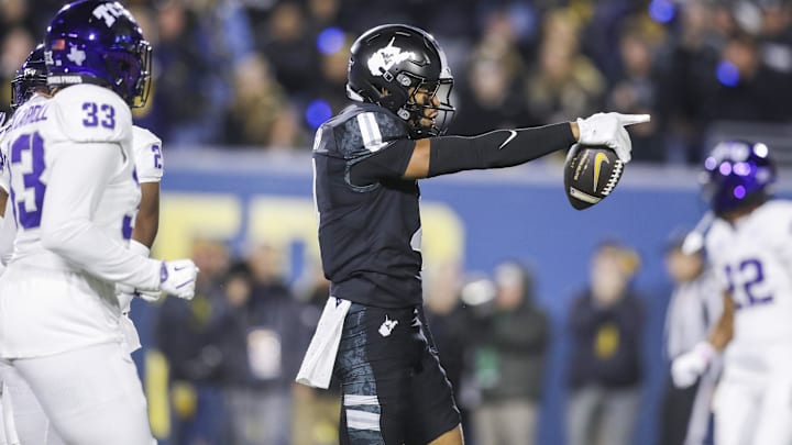 Oct 25, 2025; Morgantown, West Virginia, USA; West Virginia Mountaineers wide receiver Cam Vaughn (4) celebrates a first down after a catch during the third quarter against the Texas Christian University Horned Frogs at Milan Puskar Stadium. Mandatory Credit: Ben Queen-Imagn Images
