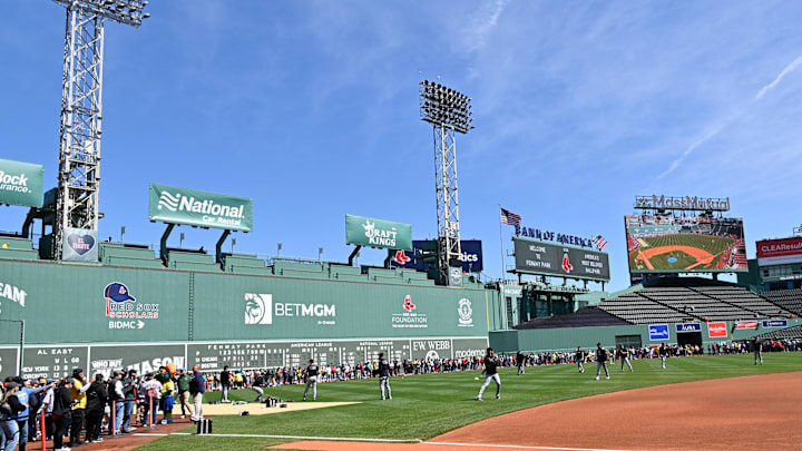 Apr 20, 2025; Boston, Massachusetts, USA; Fans line the field in front of the Green Monster as the Chicago White Sox warm up before a game at Fenway Park. Mandatory Credit: Eric Canha-Imagn Images Apr 20, 2025; Boston, Massachusetts, USA; Fans line the field in front of the Green Monster as the Chicago White Sox warm up before a game at Fenway Park. Mandatory Credit: Eric Canha-Imagn Images