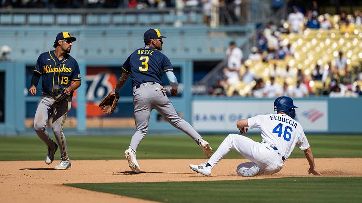 Aug 16, 2026; Los Angeles, California, USA; Milwaukee Brewers shortstop Joey Ortiz (3) turns a double play against a sliding Los Angeles Dodgers catcher Hunter Feduccia (46) in the eighth inning at Dodger Stadium. Mandatory Credit: Jon Endow-Imagn Images Aug 16, 2026; Los Angeles, California, USA; Milwaukee Brewers shortstop Joey Ortiz (3) turns a double play against a sliding Los Angeles Dodgers catcher Hunter Feduccia (46) in the eighth inning at Dodger Stadium. Mandatory Credit: Jon Endow-Imagn Images