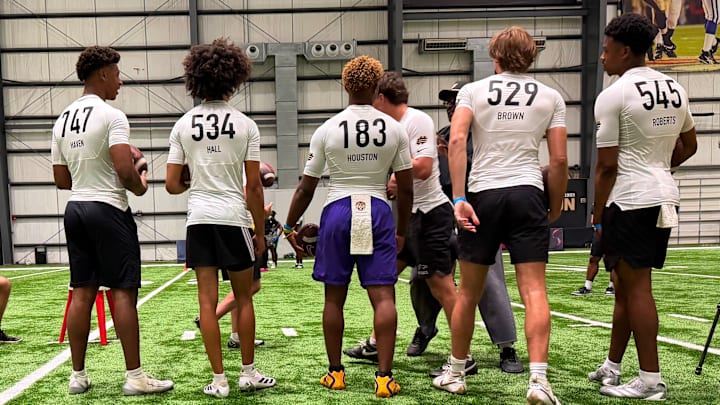 Quarterbacks from left to right: Elijah Haven, Kellen Hall, Peyton Houston, JD Brown and Jamison Roberts listen to instruction before a drill at the Elite11 camp in New Orleans Quarterbacks from left to right: Elijah Haven, Kellen Hall, Peyton Houston, JD Brown and Jamison Roberts listen to instruction before a drill at the Elite11 camp in New Orleans