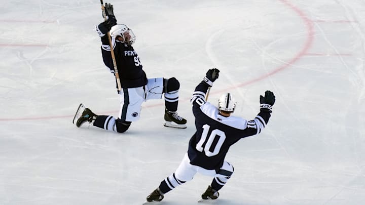 Jan 31, 2026; State College, PA, USA; Penn State Nittany Lions forward Shea Van Olm (93) celebrates his goal with Penn State Nittany Lions defenseman Nick Fascia (10) during the third period against the Michigan State Spartans at Beaver Stadium. Mandatory Credit: James Lang-Imagn Images