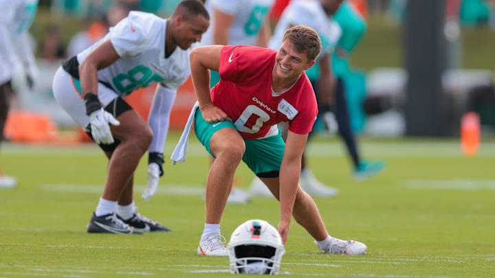 Miami Dolphins quarterback Zach Wilson (0) stretches during training camp at Baptist Health Training Complex. Miami Dolphins quarterback Zach Wilson (0) stretches during training camp at Baptist Health Training Complex.
