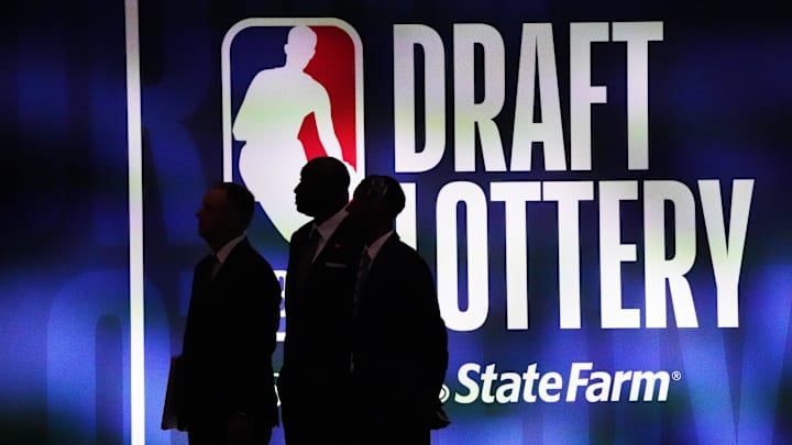 May 16, 2023; Chicago, IL, USA; People walk past the 2023 NBA Draft Lottery board at McCormick Place one year ago. May 16, 2023; Chicago, IL, USA; People walk past the 2023 NBA Draft Lottery board at McCormick Place one year ago.