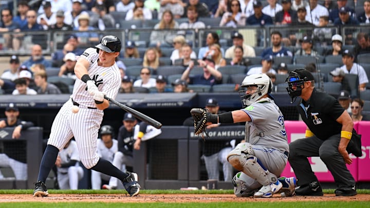 Sep 7, 2025; Bronx, New York, USA; New York Yankees first baseman Ben Rice (22) hits the ball for a homerun during the first inning against the Toronto Blue Jays at Yankee Stadium. Mandatory Credit: Mark Smith-Imagn Images