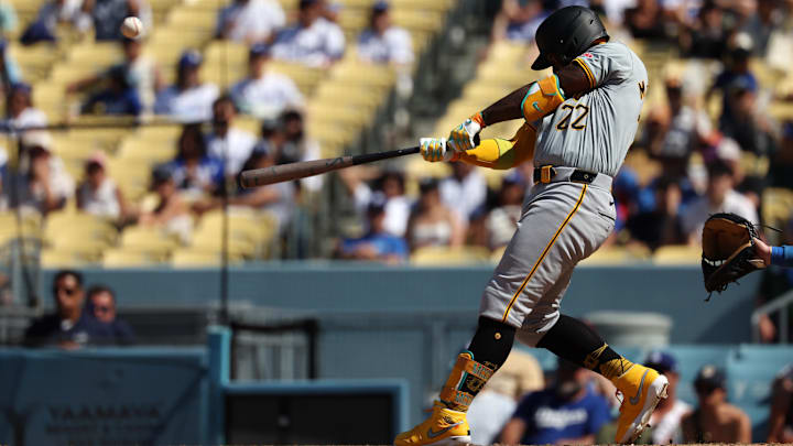 Pittsburgh Pirates designated hitter Andrew McCutchen (22) hits a game-tying 2-run home run during the eighth inning against the Los Angeles Dodgers at Dodger Stadium. 