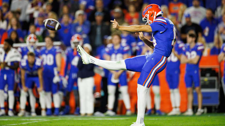 Nov 29, 2025; Gainesville, Florida, USA; Florida Gators kicker Tommy Doman (19) punts against the Florida State Seminoles during the second half at Ben Hill Griffin Stadium. Mandatory Credit: Matt Pendleton-Imagn Images