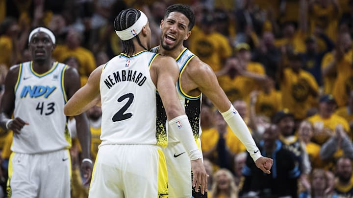 Apr 19, 2025; Indianapolis, Indiana, USA;  Indiana Pacers guard Andrew Nembhard (2) and guard Tyrese Haliburton (0) celebrate in the first half against the Milwaukee Bucks at Gainbridge Fieldhouse. Mandatory Credit: Trevor Ruszkowski-Imagn Images