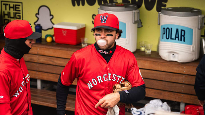 Marcelo Mayer blows a bubble with his gum in the WooSox dugout during a game on April 13, 2025 at Polar Park.