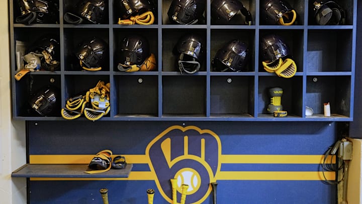 Apr 5, 2025; Milwaukee, Wisconsin, USA;  General view of Milwaukee Brewers batting helmets in the dugout prior to the game against the Cincinnati Reds at American Family Field. Mandatory Credit: Jeff Hanisch-Imagn Images