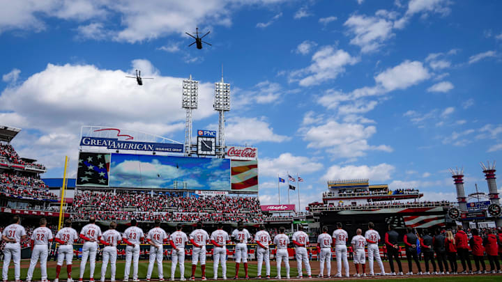 A pair of helicopters fly over the stadium during the National Anthem before the first inning of the MLB National League Opening Day game between the Cincinnati Reds and the Washington Nationals at Great American Ball Park in downtown Cincinnati on Thursday, March 28, 2024. A pair of helicopters fly over the stadium during the National Anthem before the first inning of the MLB National League Opening Day game between the Cincinnati Reds and the Washington Nationals at Great American Ball Park in downtown Cincinnati on Thursday, March 28, 2024.