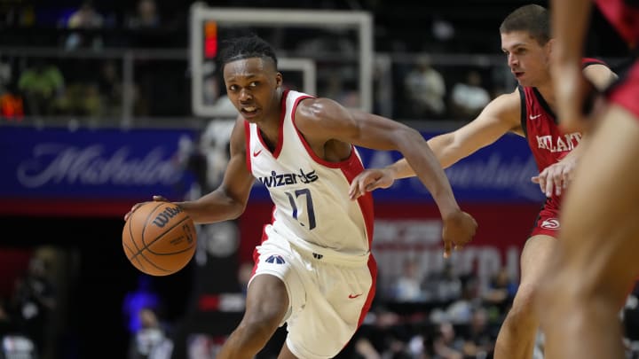 Jul 12, 2024; Las Vegas, NV, USA;  Washington Wizards guard Bub Carrington (17) drives the ball against Atlanta Hawks guard Nikola Durisic (7) during the second half at Thomas & Mack Center. Mandatory Credit: Lucas Peltier-USA TODAY Sports