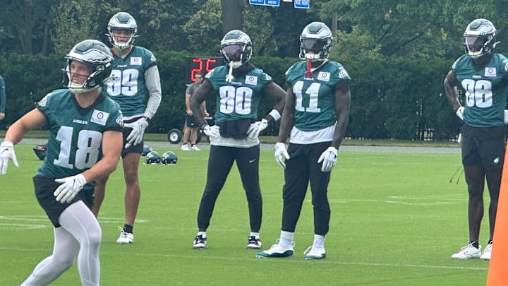 Britain Covey gets ready to make a catch as Philadelphia Eagles teammates, from left to right, Johnny Wilson, Parris Campbell, A.J. Brown, and Joseph Ngata, look on during the final day of mandatory minicamp on June 6, 2024.