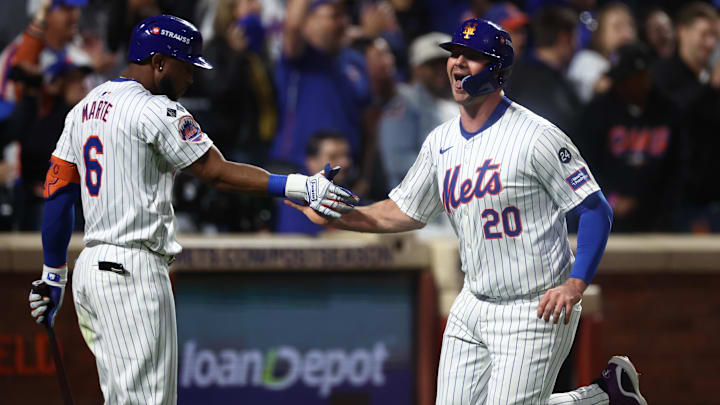 Oct 18, 2024; New York City, New York, USA; New York Mets first baseman Pete Alonso (20) high-fives right fielder Starling Marte (6) after scoring during the fourth inning against the Los Angeles Dodgers during game five of the NLCS for the 2024 MLB playoffs at Citi Field. Mandatory Credit: Vincent Carchietta-Imagn Images Oct 18, 2024; New York City, New York, USA; New York Mets first baseman Pete Alonso (20) high-fives right fielder Starling Marte (6) after scoring during the fourth inning against the Los Angeles Dodgers during game five of the NLCS for the 2024 MLB playoffs at Citi Field. Mandatory Credit: Vincent Carchietta-Imagn Images