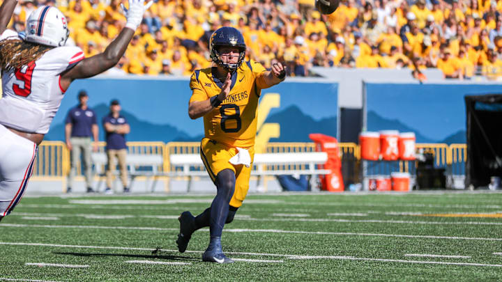 Aug 30, 2025; Morgantown, West Virginia, USA; West Virginia Mountaineers quarterback Nicco Marchiol (8) throws a pass during the third quarter against the Robert Morris Colonials at Milan Puskar Stadium. Mandatory Credit: Ben Queen-Imagn Images
