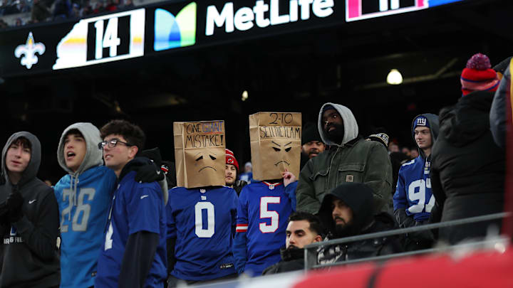 Dec 8, 2024; East Rutherford, New Jersey, USA; New York Giants fans wear paper bags on their heads during the fourth quarter against the New Orleans Saints at MetLife Stadium. Dec 8, 2024; East Rutherford, New Jersey, USA; New York Giants fans wear paper bags on their heads during the fourth quarter against the New Orleans Saints at MetLife Stadium.
