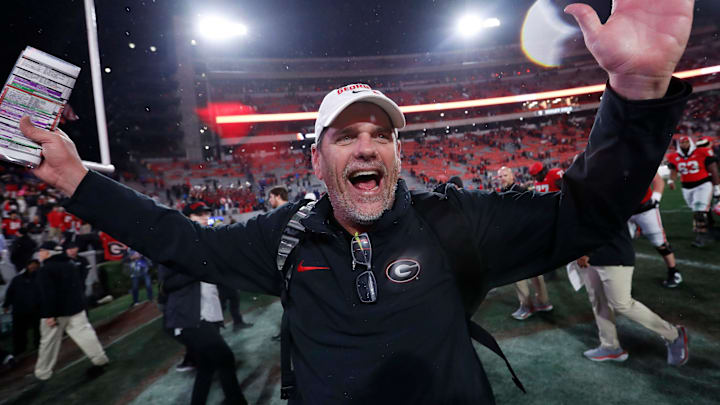 Georgia Offensive Coordinator Mike Bobo celebrates after wining a NCAA college football game against Ole Miss in Athens, Ga., on Saturday, Nov. 11, 2023. Georgia won 52-17.