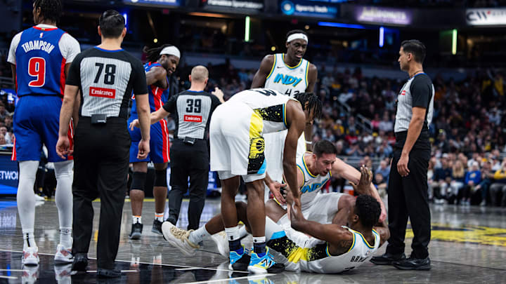 The Pistons' Isaiah Stewart, third from left, questions the referee after knocking down the Pacers' Thomas Bryant. 