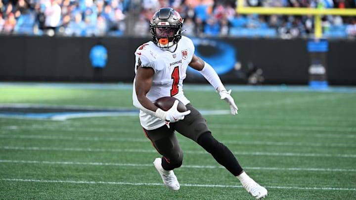 Dec 21, 2025; Charlotte, North Carolina, USA; Tampa Bay Buccaneers running back Rachaad White (1) with the ball in the third quarter at Bank of America Stadium. Mandatory Credit: Bob Donnan-Imagn Images