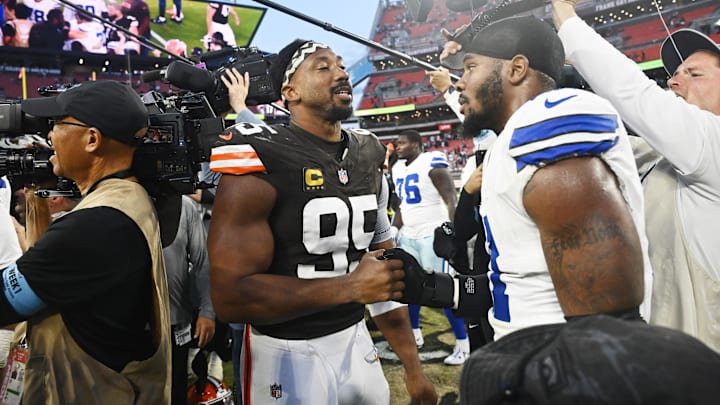 Cleveland Browns defensive end Myles Garrett talks to Dallas Cowboys linebacker Micah Parsons.