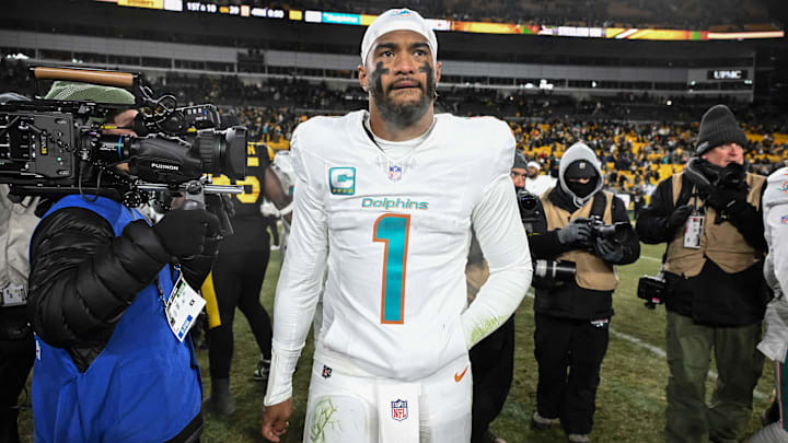 Dec 15, 2025; Pittsburgh, Pennsylvania, USA; Miami Dolphins quarterback Tua Tagovailoa (1) leaves the  field following a game against the Pittsburgh Steelers at Acrisure Stadium. Mandatory Credit: Barry Reeger-Imagn Images