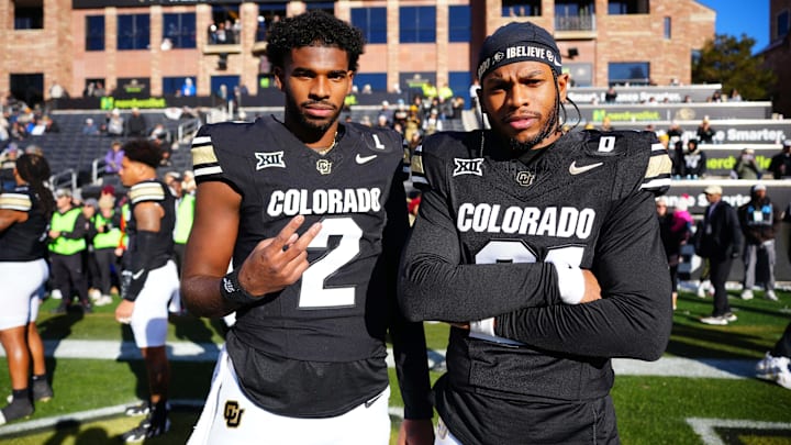 Former Colorado Buffaloes quarterback Shedeur Sanders (2) and safety Shilo Sanders (21) before the game against the Oklahoma State Cowboys at Folsom Field.