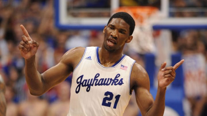 Feb 22, 2014; Lawrence, KS, USA; Kansas Jayhawks center Joel Embiid (21) celebrates after scoring in the first half against the Texas Longhorns at Allen Fieldhouse. Mandatory Credit: Denny Medley-Imagn Images Feb 22, 2014; Lawrence, KS, USA; Kansas Jayhawks center Joel Embiid (21) celebrates after scoring in the first half against the Texas Longhorns at Allen Fieldhouse. Mandatory Credit: Denny Medley-Imagn Images