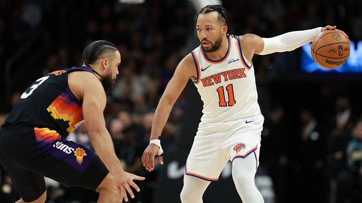 Jan 9, 2026; Phoenix, Arizona, USA; New York Knicks guard Jalen Brunson (11) controls the ball against Phoenix Suns forward Dillon Brooks (3) in the second half at Mortgage Matchup Center. Mandatory Credit: Mark J. Rebilas-Imagn Images Jan 9, 2026; Phoenix, Arizona, USA; New York Knicks guard Jalen Brunson (11) controls the ball against Phoenix Suns forward Dillon Brooks (3) in the second half at Mortgage Matchup Center. Mandatory Credit: Mark J. Rebilas-Imagn Images