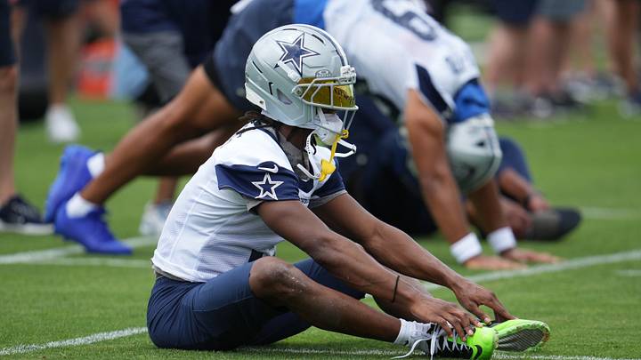 Dallas Cowboys wide receiver George Pickens stretches before practice at the Ford Center at the Star Training Facility Dallas Cowboys wide receiver George Pickens stretches before practice at the Ford Center at the Star Training Facility