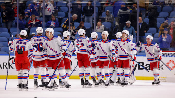 Dec 11, 2024; Buffalo, New York, USA;  The New York Rangers celebrate a win over the Buffalo Sabres at KeyBank Center. Mandatory Credit: Timothy T. Ludwig-Imagn Images