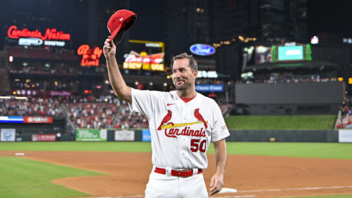 Sep 18, 2023; St. Louis, Missouri, USA;  St. Louis Cardinals starting pitcher Adam Wainwright (50) tips his cap to the fans as he receives a standing ovation after winning his 200th career game in a 1-0 victory over the Milwaukee Brewers at Busch Stadium. Mandatory Credit: Jeff Curry-Imagn Images