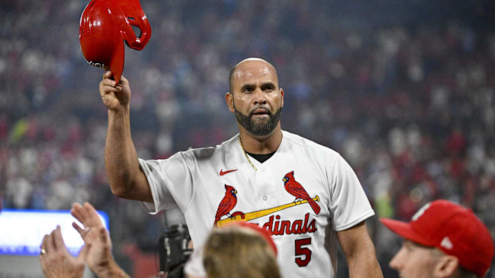 Sep 30, 2022; St. Louis, Missouri, USA; St. Louis Cardinals designated hitter Albert Pujols (5) salutes the fans as he receives a standing ovation after hitting as solo home run for his 701st career home run during the fourth inning against the Pittsburgh Pirates at Busch Stadium. Mandatory Credit: Jeff Curry-Imagn Images Sep 30, 2022; St. Louis, Missouri, USA; St. Louis Cardinals designated hitter Albert Pujols (5) salutes the fans as he receives a standing ovation after hitting as solo home run for his 701st career home run during the fourth inning against the Pittsburgh Pirates at Busch Stadium. Mandatory Credit: Jeff Curry-Imagn Images