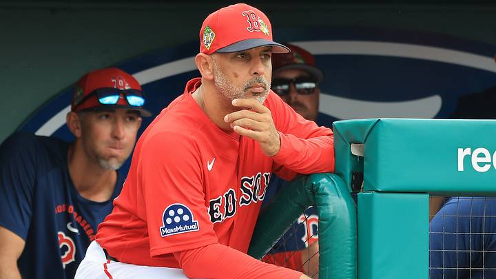 Boston Red Sox manager Alex Cora (13) looks on from the dugout during the third inning against the Toronto Blue Jays.