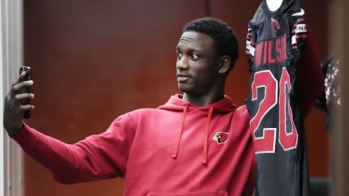 Former Arizona Cardinals cornerback Divaad Wilson takes a picture during pack-up day at the Cardinals facility Former Arizona Cardinals cornerback Divaad Wilson takes a picture during pack-up day at the Cardinals facility
