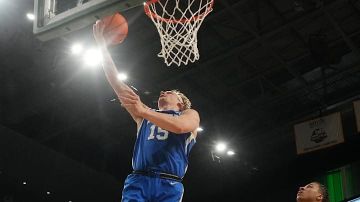 Feb 10, 2026; Waco, Texas, USA;  BYU Cougars guard Richie Saunders (15) scores a layup ahead of Baylor Bears guard Cameron Carr (43) during the second half at Paul and Alejandra Foster Pavilion. Mandatory Credit: Chris Jones-Imagn Images