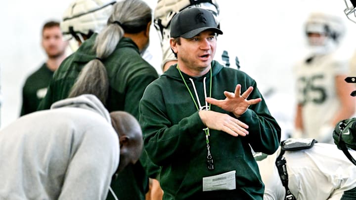 Michigan State's head coach Jonathan Smith, left, talks with Justin Bell during football practice on Tuesday, April 8, 2025, in East Lansing. Michigan State's head coach Jonathan Smith, left, talks with Justin Bell during football practice on Tuesday, April 8, 2025, in East Lansing.