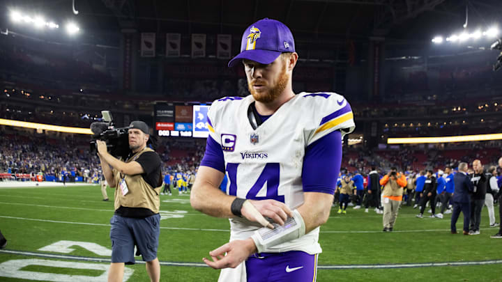 Jan 13, 2025; Glendale, AZ, USA; Minnesota Vikings quarterback Sam Darnold (14) reacts as he walks off the field after losing to the Los Angeles Rams during an NFC wild card game at State Farm Stadium. Mandatory Credit: Mark J. Rebilas-Imagn Images