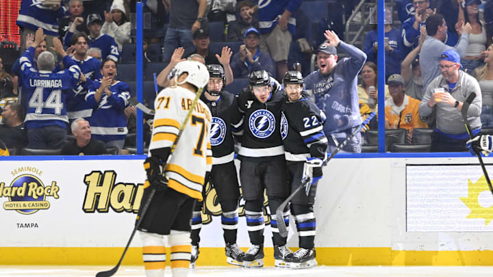 Apr 4, 2026; Tampa, Florida, USA; Tampa Bay Lightning teammates celebrate a goal during the third period against Boston Bruins at Benchmark International Arena. Mandatory Credit: Pablo Robles-Imagn Images