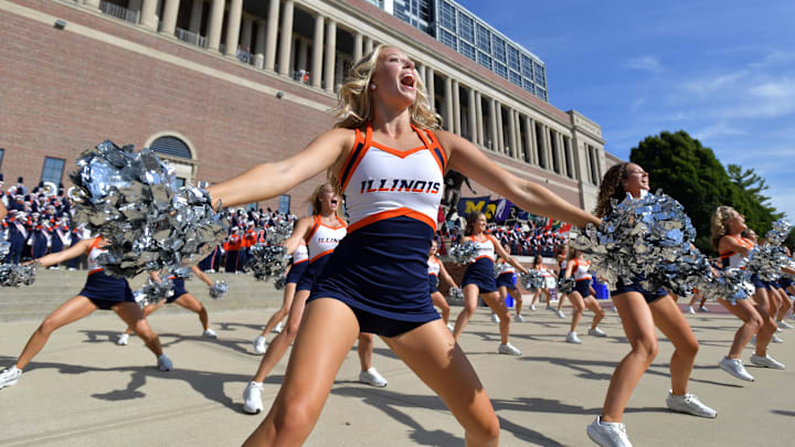 Aug 29, 2025; Champaign, Illinois, USA;  The Illinois Fighting Illini cheer squad performs before an NCAA football game against the Western Illinois Leathernecks at Memorial Stadium. Mandatory Credit: Ron Johnson-Imagn Images