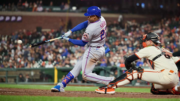 Apr 2, 2026; San Francisco, California, USA; New York Mets outfielder Juan Soto (22) hits a single against San Francisco Giants catcher Daniel Susac (6) during the eighth inning at Oracle Park. Mandatory Credit: Robert Edwards-Imagn Images