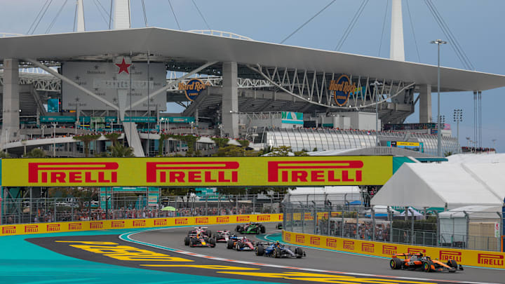 May 4, 2025; Miami Gardens, FL, USA; McLaren driver Lando Norris (4) races ahead of Williams driver Carlos Sainz (55) during the F1 Miami Grand Prix at Miami International Autodrome. Mandatory Credit: Sam Navarro-Imagn Images