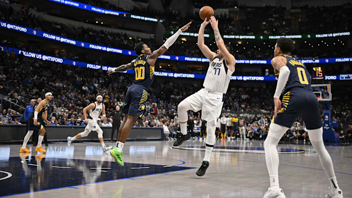 Nov 4, 2024; Dallas, Texas, USA; Indiana Pacers guard Bennedict Mathurin (00) and guard Tyrese Haliburton (0) and Dallas Mavericks guard Luka Doncic (77) in action during the game between the Dallas Mavericks and the Indiana Pacers at American Airlines Center. Mandatory Credit: Jerome Miron-Imagn Images Nov 4, 2024; Dallas, Texas, USA; Indiana Pacers guard Bennedict Mathurin (00) and guard Tyrese Haliburton (0) and Dallas Mavericks guard Luka Doncic (77) in action during the game between the Dallas Mavericks and the Indiana Pacers at American Airlines Center. Mandatory Credit: Jerome Miron-Imagn Images