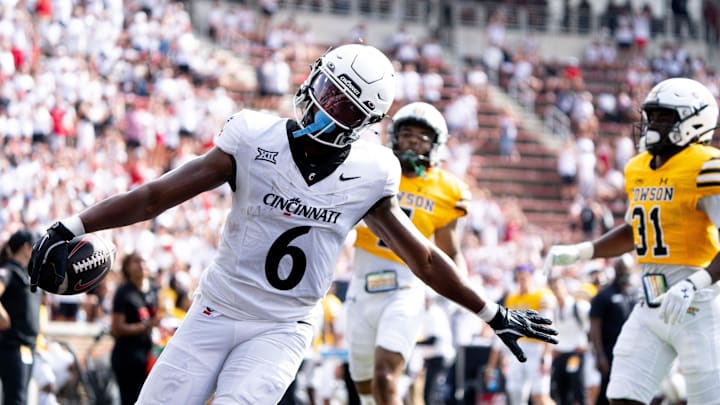 Cincinnati Bearcats running back Evan Pryor (6) gestures a she scores a touchdown in the third quarter of the College Football game between the Cincinnati Bearcats and the Towson Tigers at Nippert Stadium in Cincinnati on Saturday, Aug. 31, 2024.