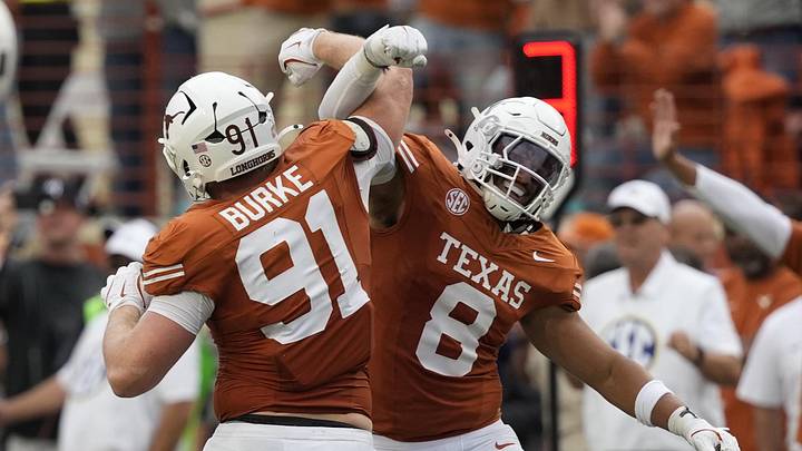 Texas Longhorns linebacker Trey Moore and defensive lineman Ethan Burke react to a defensive stop during the second half against the Vanderbilt Commodores at Darrell K Royal – Texas Memorial Stadium. Texas Longhorns linebacker Trey Moore and defensive lineman Ethan Burke react to a defensive stop during the second half against the Vanderbilt Commodores at Darrell K Royal – Texas Memorial Stadium.
