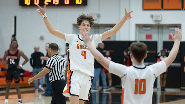 Green   s Nikola Bundalo (4) and Tommy Zajac (10) celebrate their 54-51 win over McKinley on Friday, Feb. 3, 2023.

Mckinley Green Boys Basketball 003