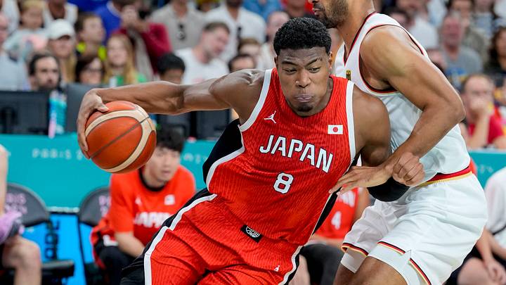 Jul 27, 2024; Villeneuve-d'Ascq, France; Japan small forward Rui Hachimura (8) pushes past Germany power forward Johannes Thiemann (32) during the Paris 2024 Olympic Summer Games at Stade Pierre-Mauroy. Jul 27, 2024; Villeneuve-d'Ascq, France; Japan small forward Rui Hachimura (8) pushes past Germany power forward Johannes Thiemann (32) during the Paris 2024 Olympic Summer Games at Stade Pierre-Mauroy.