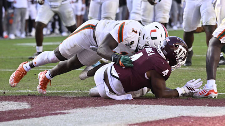 Dec 20, 2025; College Station, TX, USA; Miami Hurricanes linebacker Mohamed Toure (1) hits Texas A&M Aggies running back Rueben Owens II (4) at the goal line during the second half of the first round game of the CFP National Playoff at Kyle Field. Mandatory Credit: Jerome Miron-Imagn Images
