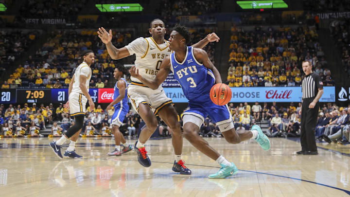 Feb 28, 2026; Morgantown, West Virginia, USA; BYU Cougars forward AJ Dybantsa (3) drives against West Virginia Mountaineers forward Brenen Lorient (0) during the first half at Hope Coliseum. Mandatory Credit: Ben Queen-Imagn Images