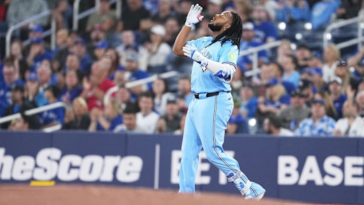 May 11, 2024; Toronto, Ontario, CAN; Toronto Blue Jays first base Vladimir Guerrero Jr. (27) celebrates hitting a single against the Minnesota Twins during the first inning at Rogers Centre. Mandatory Credit: Nick Turchiaro-USA TODAY Sports